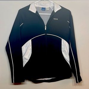 Reebok zip up athletic jacket.  Size small.  In excellent condition.